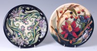 Lot 100 - A Moorcroft pottery plate in the Isis pattern,...