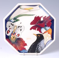 Lot 111 - A Moorcroft pottery plate in the Medley...