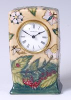 Lot 129 - A Moorcroft pottery clock in the Fruit Garden...