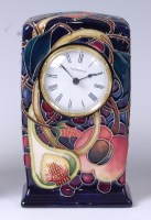 Lot 130 - A Moorcroft pottery clock in the Queens Choice...
