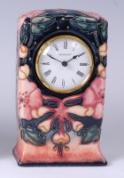 Lot 131 - A Moorcroft pottery clock in the Oberon...