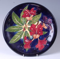 Lot 136 - A large Moorcroft pottery charger in the...