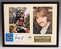 Lot 801 - A framed and signed card bearing the signature...