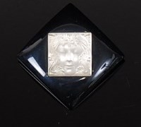 Lot 380 - A Lalique Masque de Femme brooch, with square...