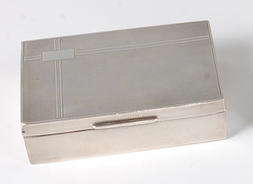 Lot 419 - An Art Deco silver table cigarette box, having...