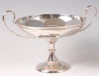 Lot 434 - An early Art Deco silver twin handled pedestal...