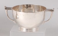Lot 435 - A late Art Deco silver twin handled circular...
