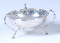 Lot 449 - An Art Nouveau silver three handled bonbon...