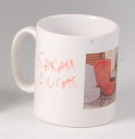 Lot 480 - Sarah Lucas (b.1962) - A signed coffee mug,...