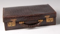 Lot 485 - An early 20th century crocodile skin...