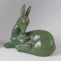 Lot 490 - Georges Laurent - An Art Deco green patinated...