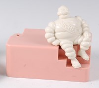 Lot 492 - A Michelin bakelite employees money-box,...