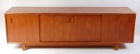 Lot 673 - A 1960s Danish teak long sideboard, having...