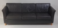 Lot 679 - A 1960s Danish black leather upholstered three-...