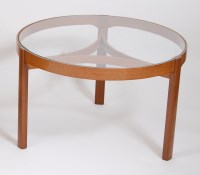 Lot 682 - A 1960s teak circular and clear glass inset...