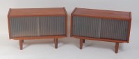 Lot 694 - A pair of 1960s Danish teak low side cabinets,...