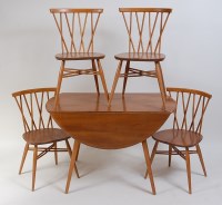 Lot 698 - Ercol - A blond elm breakfast suite,...