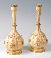 Lot 1032 - A pair of Royal Worcester blush ware lobed...