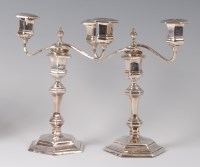 Lot 1082 - A pair of silver two-light candelabra, each in...
