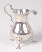Lot 1090 - A George II silver cream jug, of helmet form,...