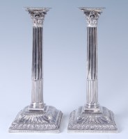 Lot 1096 - A pair of early George III silver candlesticks,...