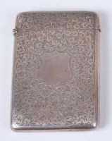 Lot 1097 - An Edwardian silver card case, having all-over...