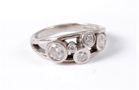 Lot 1123 - A diamond and palladium dress ring, the five...