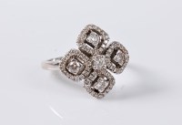 Lot 1125 - An early 20th century style diamond dress ring,...