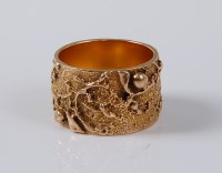 Lot 1131 - A 9ct artisan ring, the 11.9mm wide band, with...