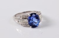 Lot 1136 - A tanzanite and diamond ring, the oval...