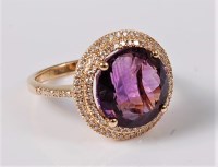 Lot 1137 - An amethyst and diamond ring, the round...