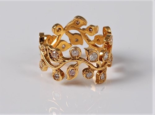 Lot 1140 - An 18ct diamond 'floral sprig' ring, the...