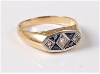 Lot 1150 - An 18ct Art Deco style ring, the three...