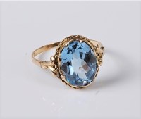 Lot 1153 - A synthetic spinel ring, the oval fancy cut...