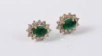 Lot 1167 - A pair of 18ct emerald and diamond earstuds,...