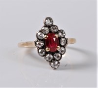 Lot 1169 - A synthetic ruby and diamond ring, the oval...