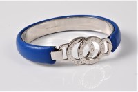 Lot 1182 - A Bulgari bracelet, the blue leather overlaid...