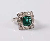 Lot 1186 - An emerald and diamond cluster ring, the...