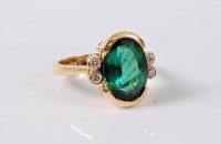Lot 1188 - A green tourmaline and diamond dress ring, the...