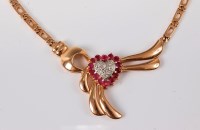 Lot 1190 - A ruby and diamond heart necklace, the diamond...