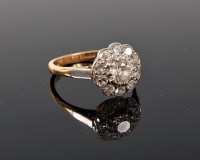 Lot 1201 - A diamond cluster ring, the central old round...