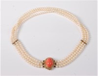 Lot 1202 - A cultured pearl and coral choker, the three...