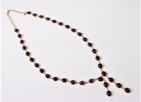 Lot 1208 - An amethyst negligee necklace, the oval...