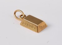 Lot 1226 - A Cartier miniature 18ct gold bar, stamped...