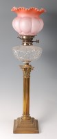 Lot 1258 - A Victorian brass Corinthian column oil lamp,...