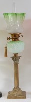 Lot 1263 - A late Victorian embossed brass pedestal oil...