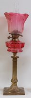 Lot 1264 - A late Victorian brass pedestal oil lamp,...