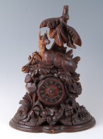 Lot 1430 - A 19th century Black Forest mantel clock,...