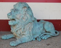 Lot 1444 - A bronze recumbent lion, of good size, with...