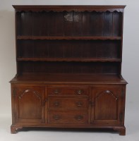 Lot 1445 - An oak dresser in the George III style, having...
